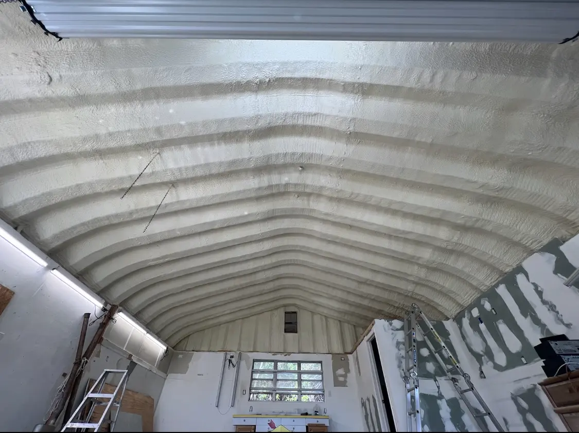 Spray polyurethane foam applied to the underside of a metal roof deck in Fort Collins